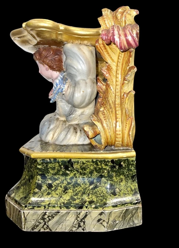 Carved and painted wooden statue base.