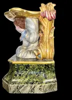Carved and painted wooden statue base.