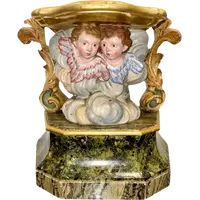 Carved and painted wooden statue base.