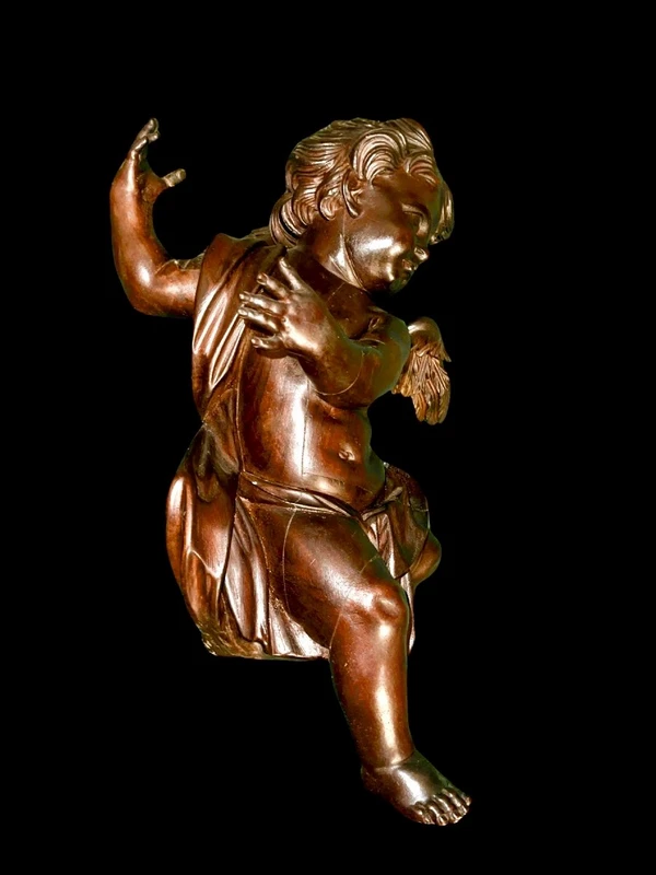 Paire d'anges en bois sculpté, non peints, à accrocher au mur. Ligurie.