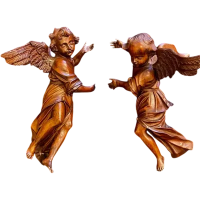 A pair of full-length angels carved from wood. Liguria.