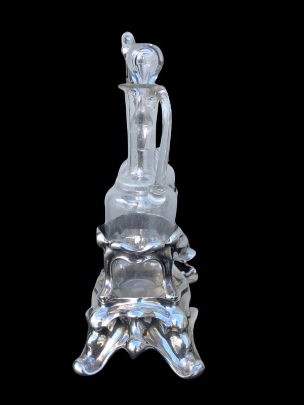Silver oil cruet with embossed Art Nouveau motifs. Minerva hallmark. France.