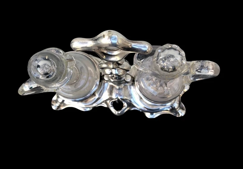 Silver oil cruet with embossed Art Nouveau motifs. Minerva hallmark. France.