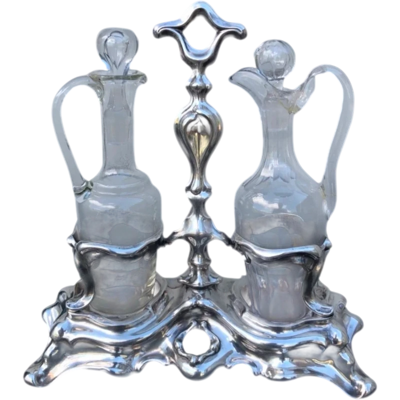 Silver oil cruet with embossed Art Nouveau motifs. Minerva hallmark. France.