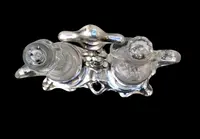 Silver oil cruet with embossed Art Nouveau motifs. Minerva hallmark. France.