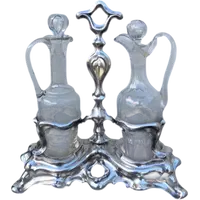 Silver oil cruet with embossed Art Nouveau motifs. Minerva hallmark. France.