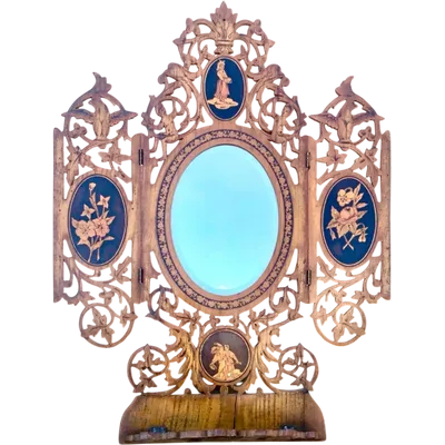 Travel mirror with two folding doors made of carved and inlaid wood