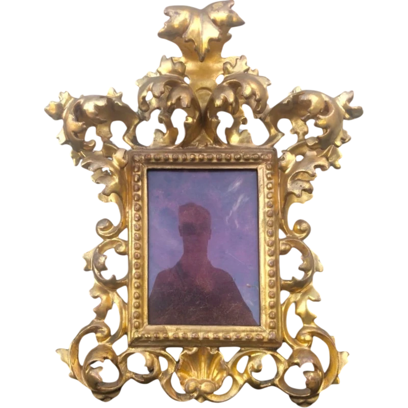 Rectangular box frame made of carved, openwork wood with gold leaf. Florence.