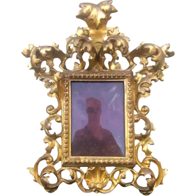 Rectangular box frame made of carved, openwork wood with gold leaf. Florence.