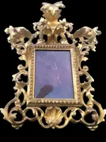 Rectangular box frame made of carved, openwork wood with gold leaf. Florence.