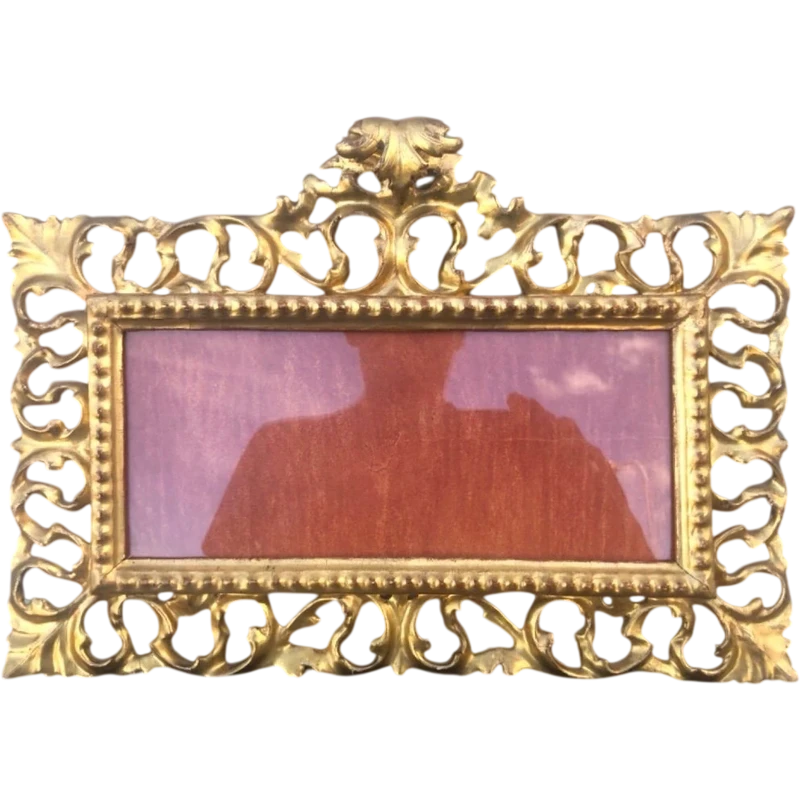 Rectangular box frame made of carved, openwork wood with gold leaf. Florence.