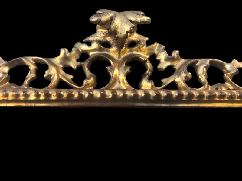 Rectangular box frame made of carved, openwork wood with gold leaf. Florence.