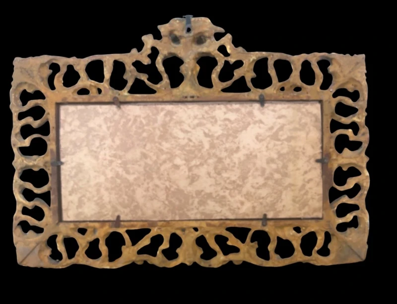 Rectangular box frame made of carved, openwork wood with gold leaf. Florence.
