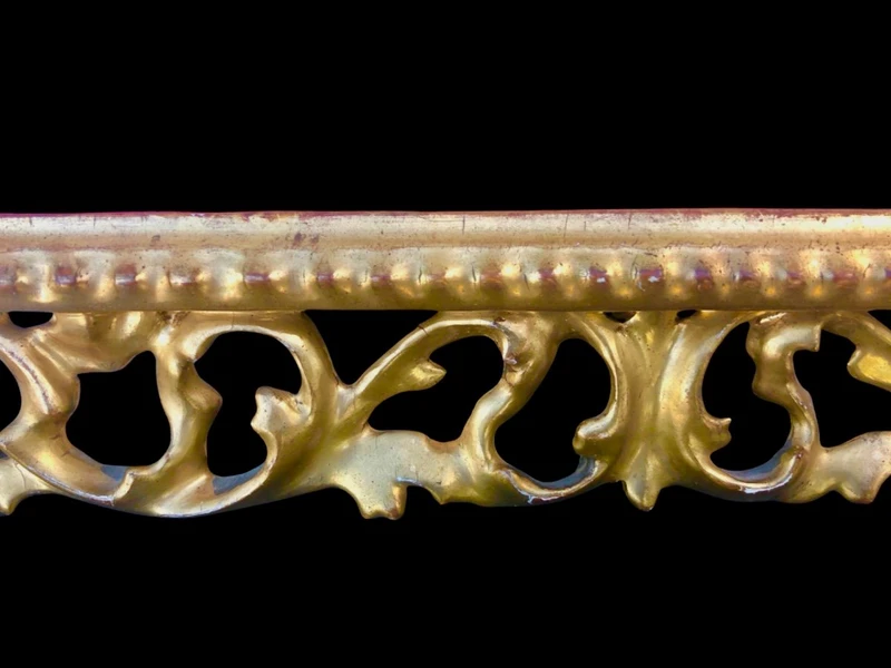 Rectangular box frame made of carved, openwork wood with gold leaf. Florence.