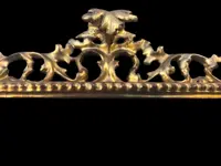 Rectangular box frame made of carved, openwork wood with gold leaf. Florence.