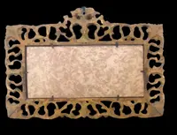 Rectangular box frame made of carved, openwork wood with gold leaf. Florence.