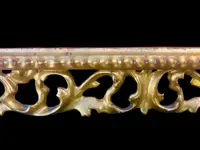 Rectangular box frame made of carved, openwork wood with gold leaf. Florence.