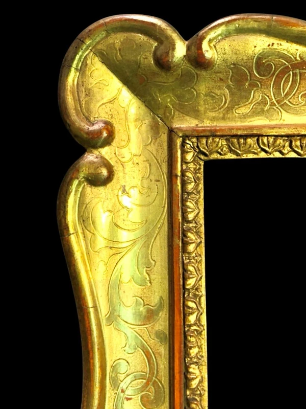 Four cabaret-style frames made of carved wood, featuring scrollwork and gold leaf.