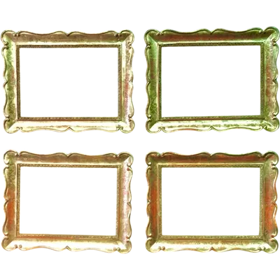 Four cabaret-style frames made of carved wood, featuring scrollwork and gold leaf.