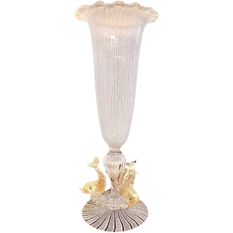 A bowl-shaped vase made of zanfirico glass with gold inclusions, featuring three dolphins on the base. Fratelli Toso.