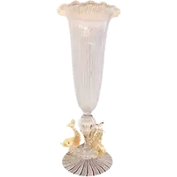 A bowl-shaped vase made of zanfirico glass with gold inclusions, featuring three dolphins on the base. Fratelli Toso.