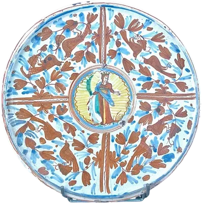 Alzata in maiolica a decoro calligrafico-naturalistico con al centro figura di Santa