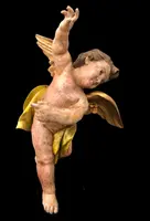 Polychrome carved wooden sculpture depicting an angel with outstretched wings. Liguria.
