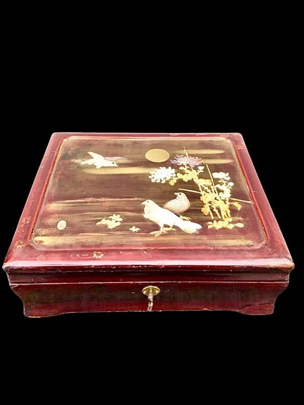 Mahogany box with inlays of various materials and mother-of-pearl