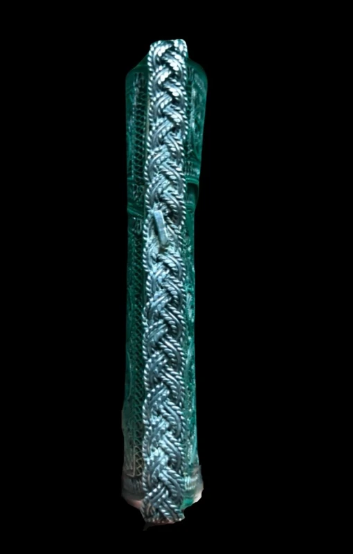 Silver filigree card holder featuring plant motifs and stylized scrolls.