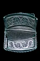Silver filigree card holder featuring plant motifs and stylized scrolls.