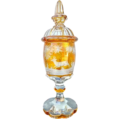 Large glass with a Bohemian glass lid, double-walled and faceted with hunting scenes.