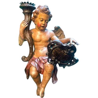 Polychrome wooden sculpture depicting an angel holding a candlestick and a rocaille shield