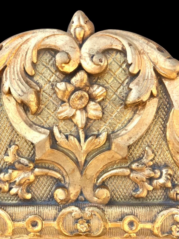 Frame - a carved and gilded wooden mirror featuring floral and rocaille motifs.