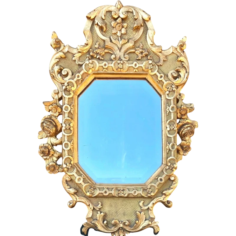 Frame - a carved and gilded wooden mirror featuring floral and rocaille motifs.