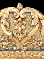 Frame - a carved and gilded wooden mirror featuring floral and rocaille motifs.