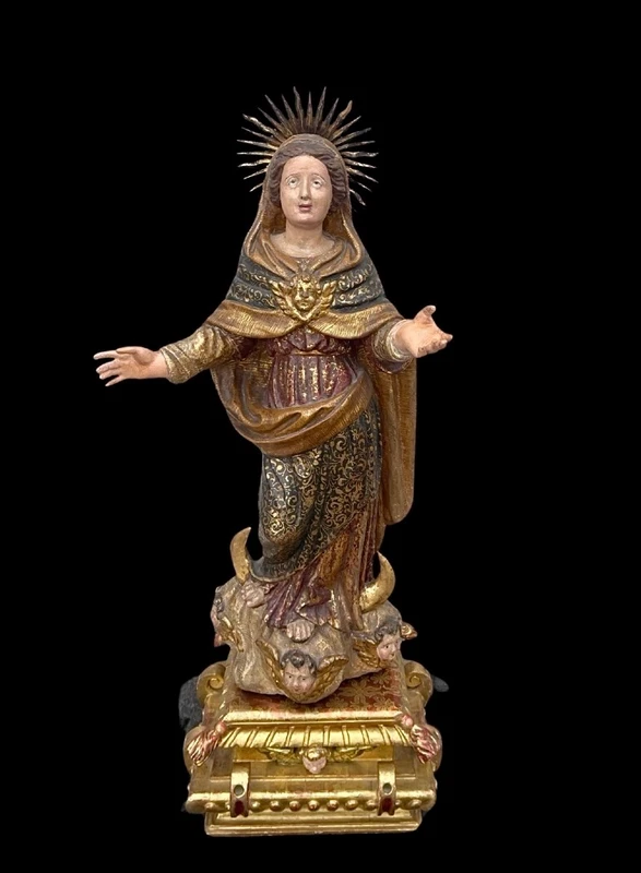 Polychrome wooden sculpture with gold highlights; Madonna wearing a silver crown. Liguria.