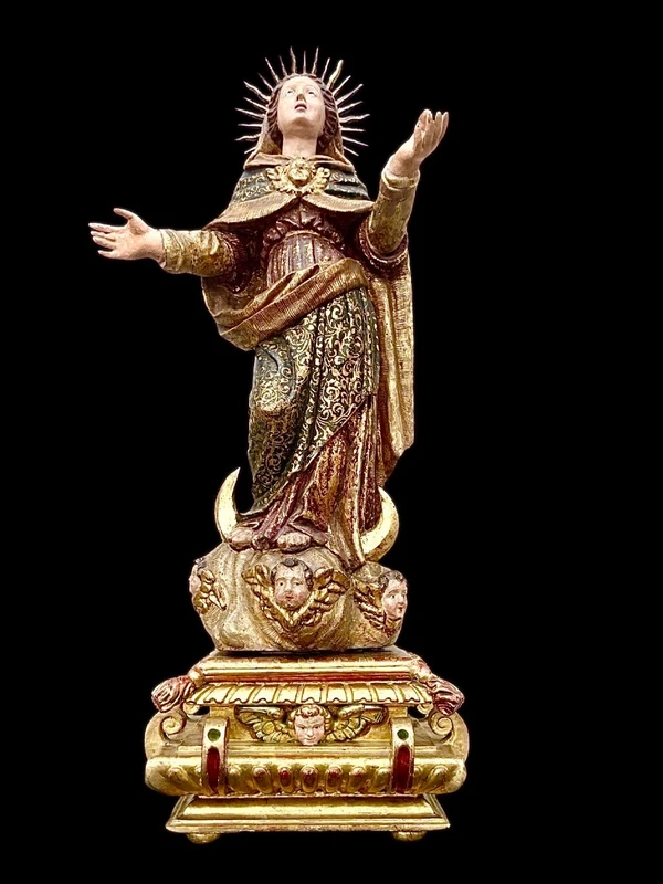 Polychrome wooden sculpture with gold highlights; Madonna wearing a silver crown. Liguria.