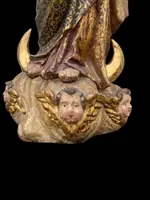 Polychrome wooden sculpture with gold highlights; Madonna wearing a silver crown. Liguria.