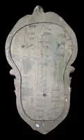 Cristo in avorio su cornice rocaille in legno dorato.