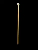 Cane with a round ivory knob carved with Commedia dell'Arte masks. Japan.