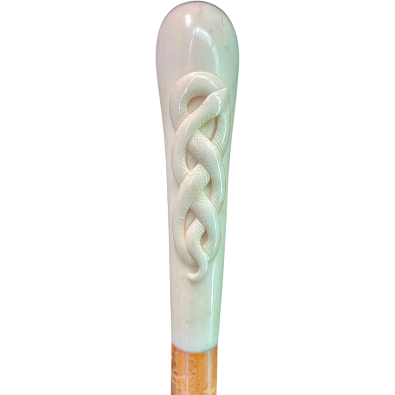 Cane with a spherical ivory knob featuring an intertwined snake engraved in high relief