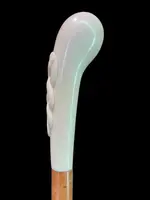 Cane with a spherical ivory knob featuring an intertwined snake engraved in high relief