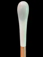 Cane with a spherical ivory knob featuring an intertwined snake engraved in high relief