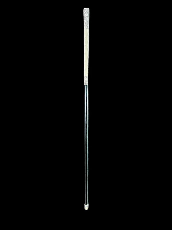 An ivory "evening" cane with tips and embossed silver featuring rocaille motifs