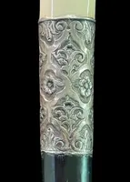 An ivory "evening" cane with tips and embossed silver featuring rocaille motifs