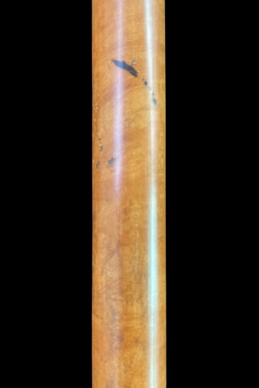 A walking stick with an ivory knob depicting a rose.