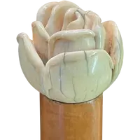 A walking stick with an ivory knob depicting a rose.