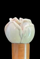 A walking stick with an ivory knob depicting a rose.
