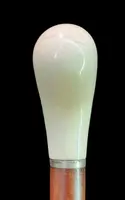 Cane with a spherical ivory knob on one side, engraved with a female figure