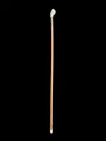 Cane with a spherical ivory knob on one side, engraved with a female figure